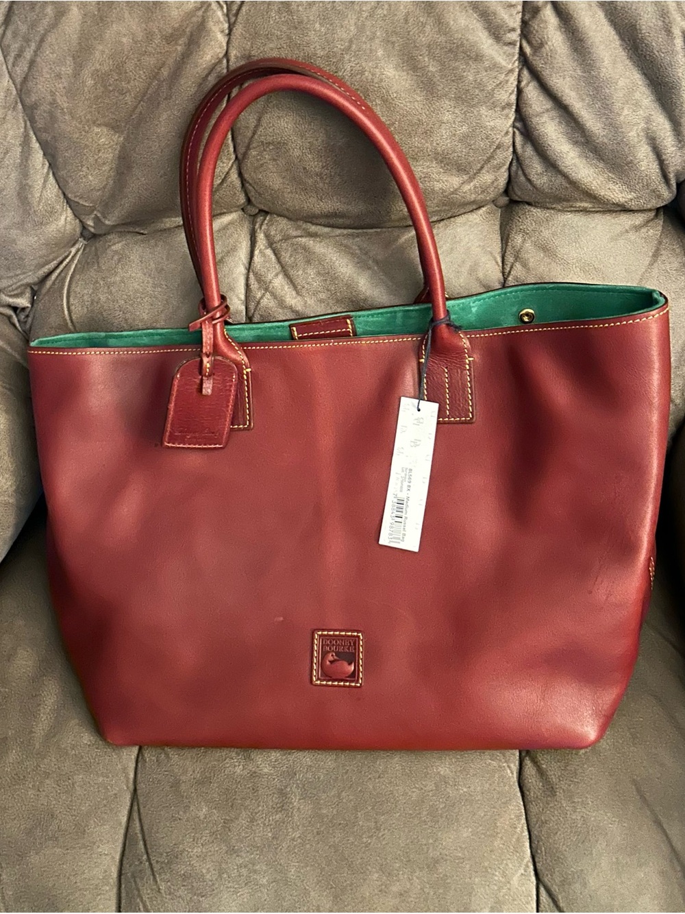 NWT Dooney & Bourke Pre-Loved Florentine
Medium Russel in a Bordeaux